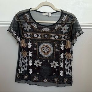 Hinge blouse. Embroidered and sheer.